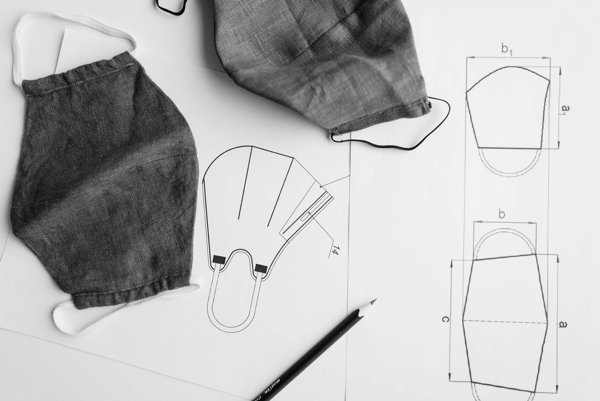 detailed shot of fabric facemasks and sewing
