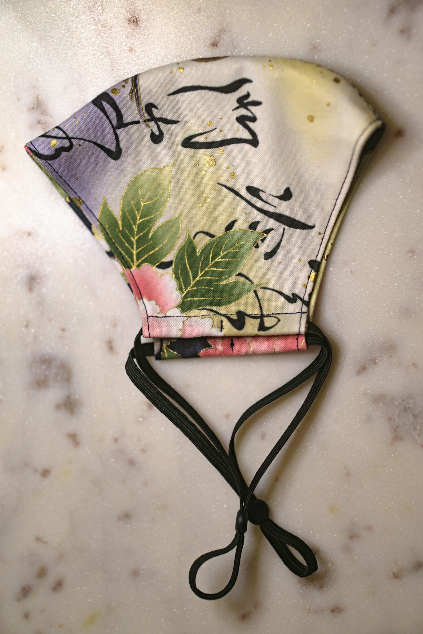 floral face mask with ties on a